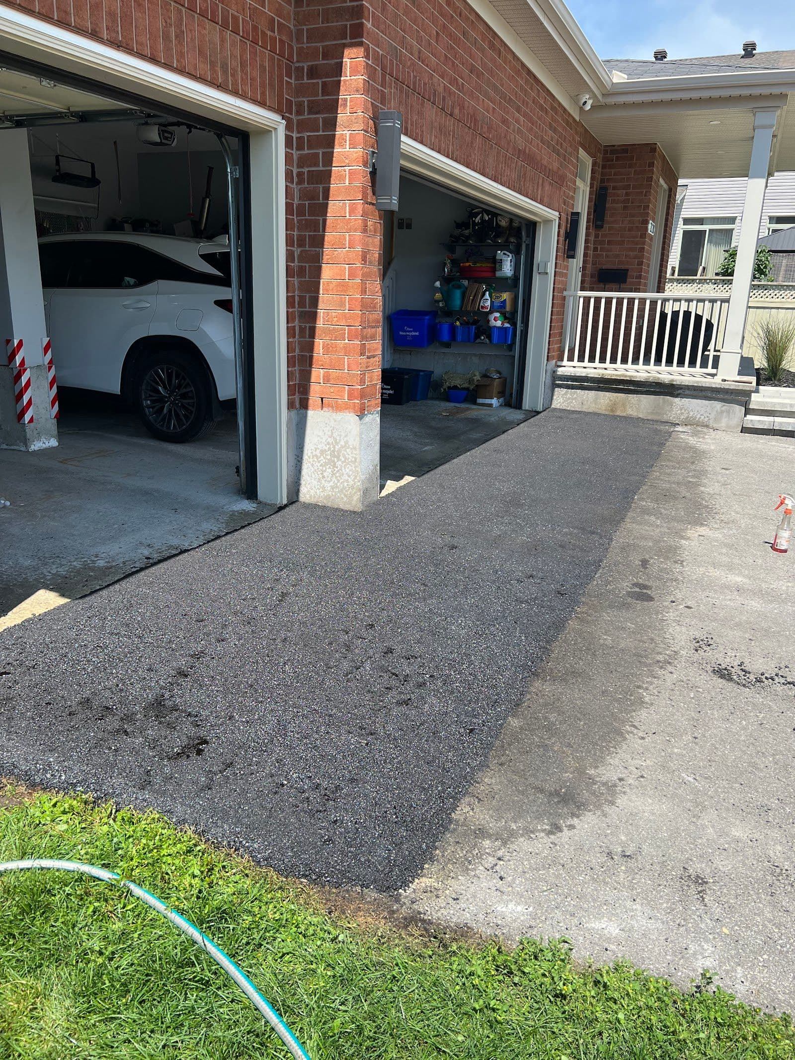A home services crew reviewing customer feedback together on a tablet while parked in their work truck at a residential job site